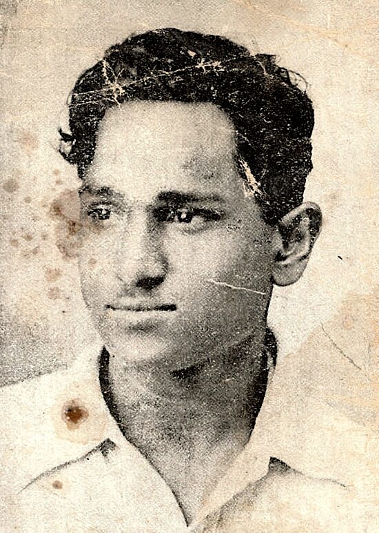 Aged, stained and scratched photograph of a young Batukeshwar Dutt, reproduced from a Lahore Conspiracy Case poster dated 9 October 1930.