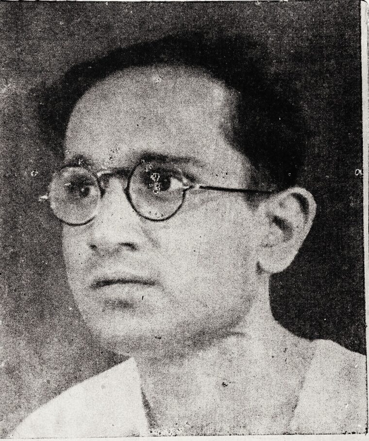 Newspaper-reproduced portrait of Batukeshwar Dutt in round spectacles.